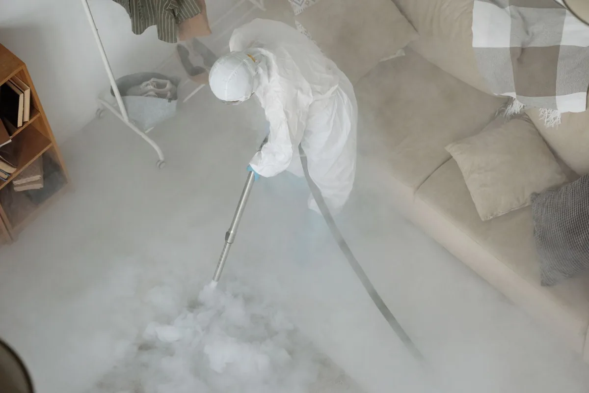 Biohazard cleanup technician in protective equipment, Hanover, MN